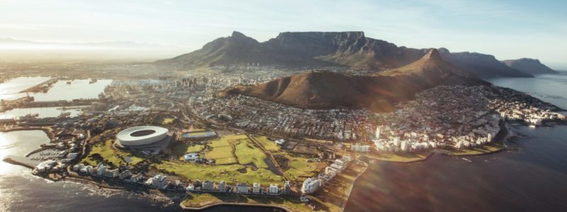Aerial view of Cape Town with Cape Town Stadium, Lion's Head and Table mountain.