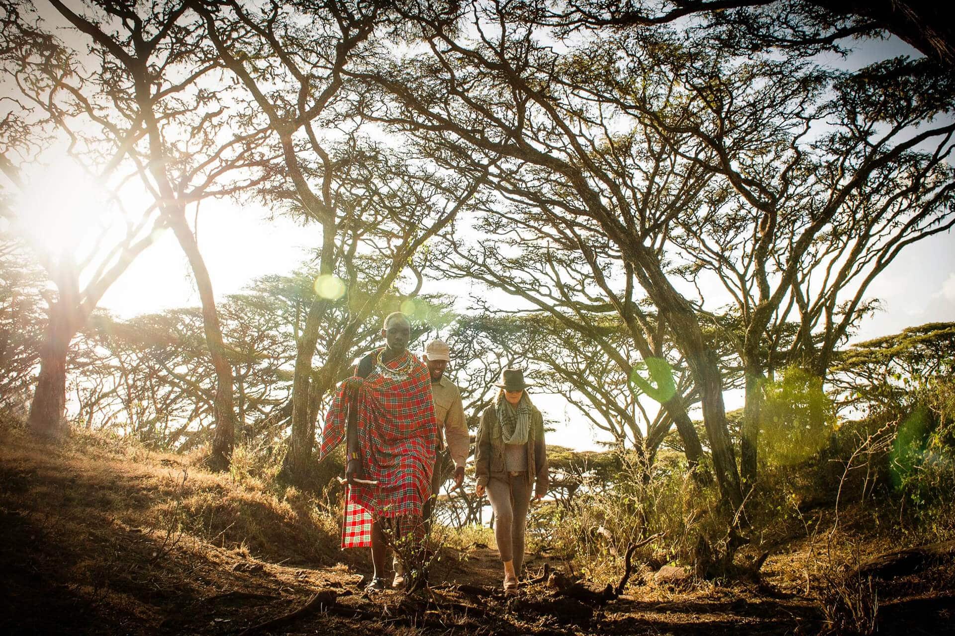 Guests on a crater rim walk guided by a Maasai naturalist