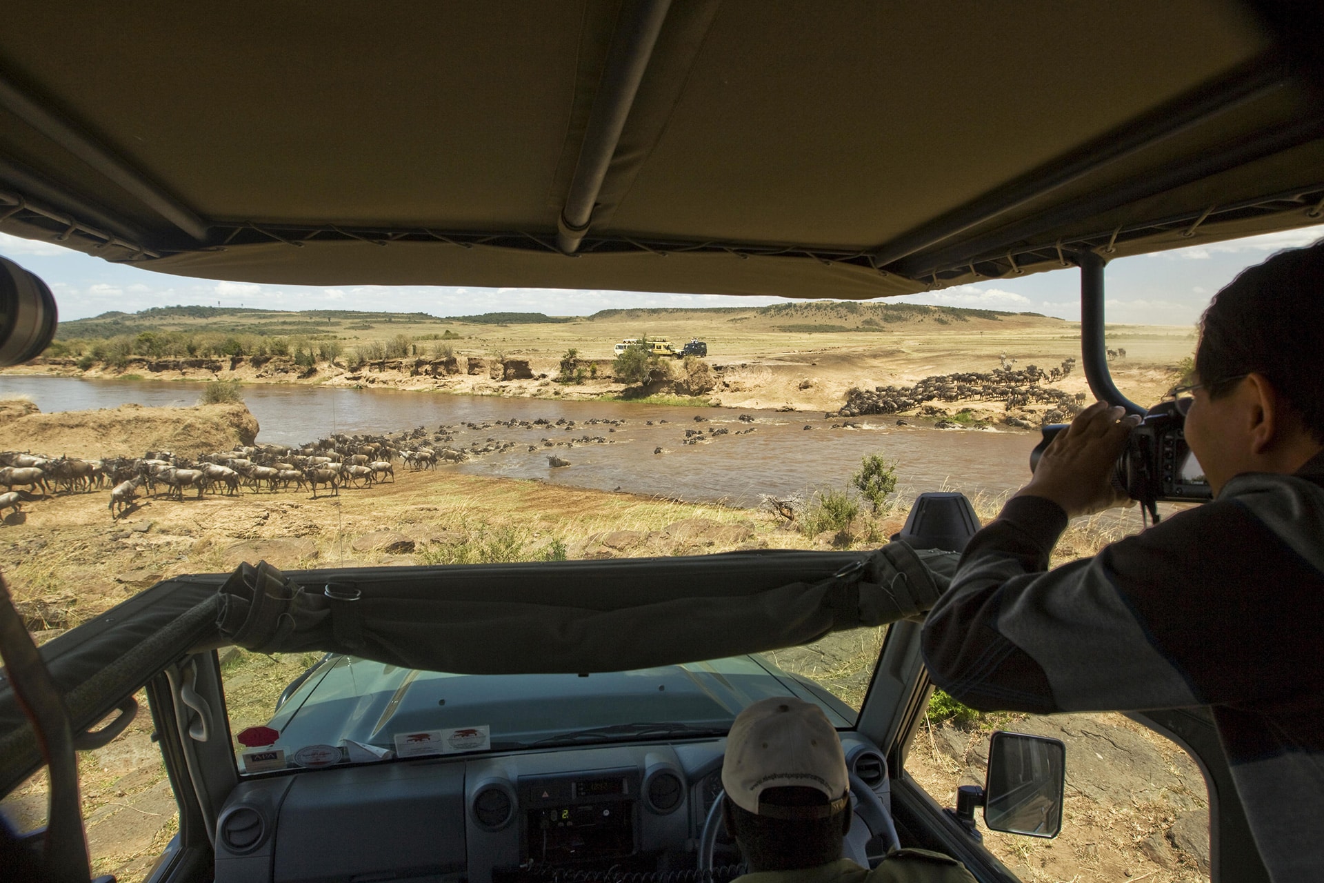 Witness the Great Wildebeest Migration while staying at one of the masai mara safari lodges