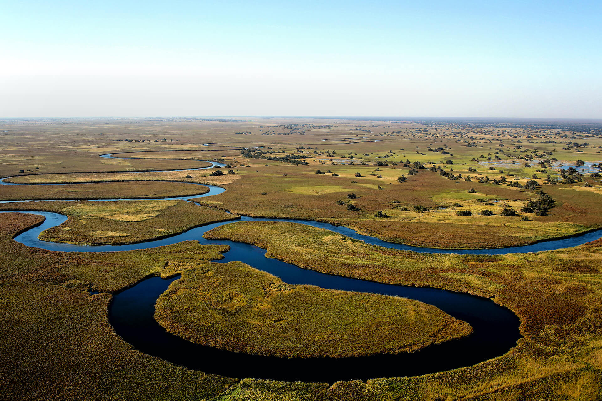 The river channels of the Okavango Delta in Botswana. Ariel view natural African landscape.