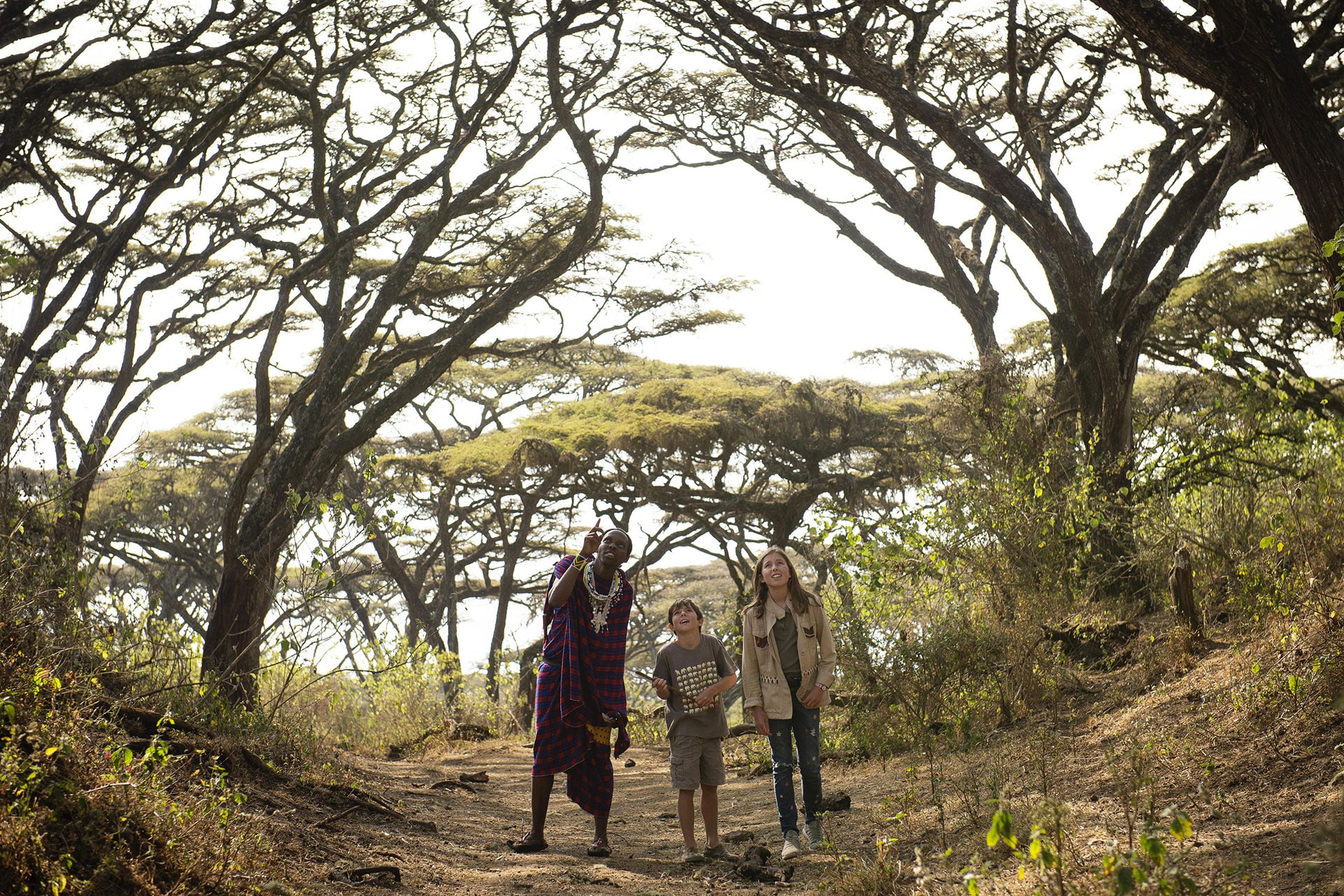 Guided walk alongside a Maasai warrior during an African safari with children