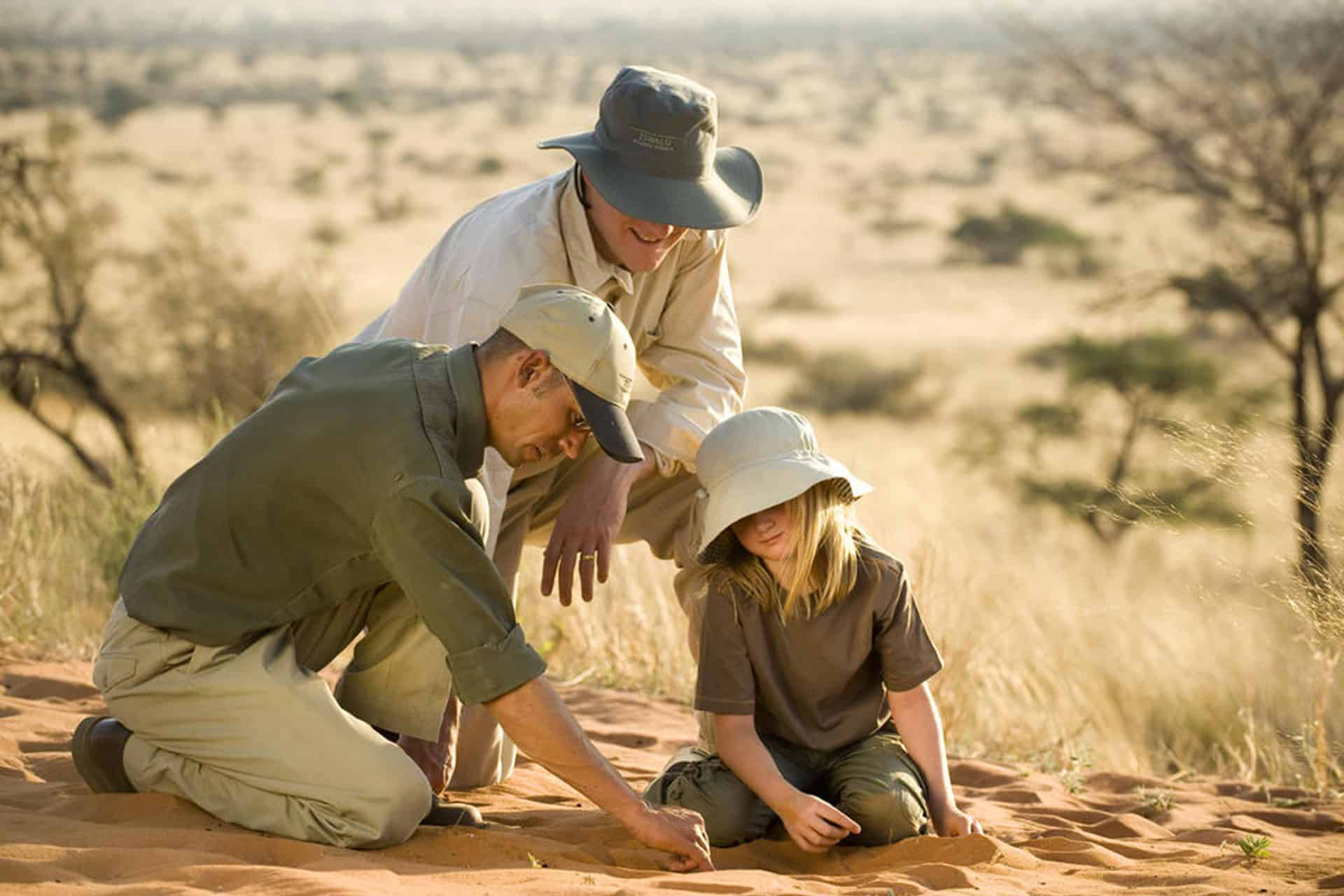 Learning to identify spoor at Tswalu Kalahari taken during an African safari with children