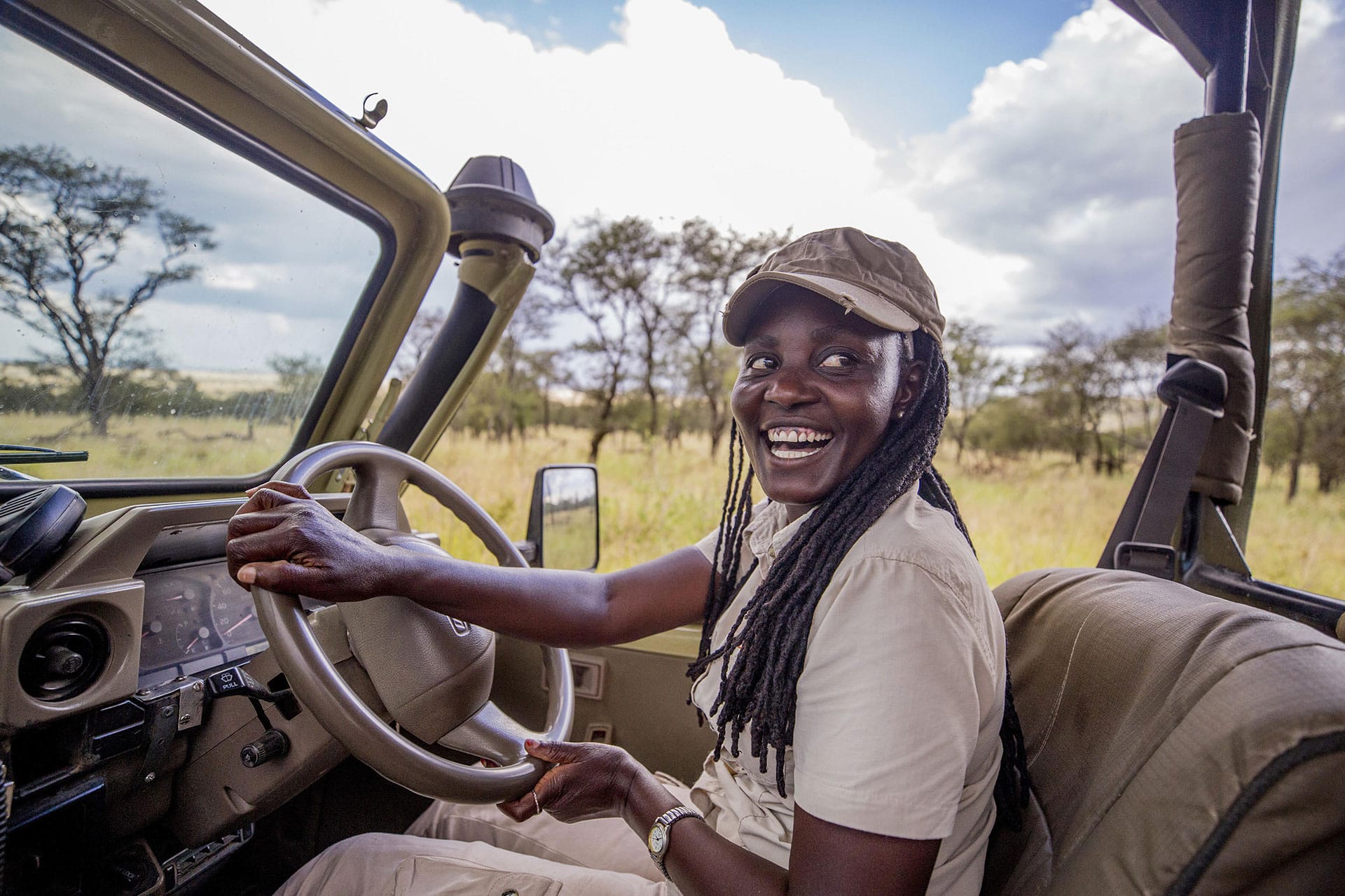 A female guide in a safari vehicle at Dunia Camp in the Serengeti
