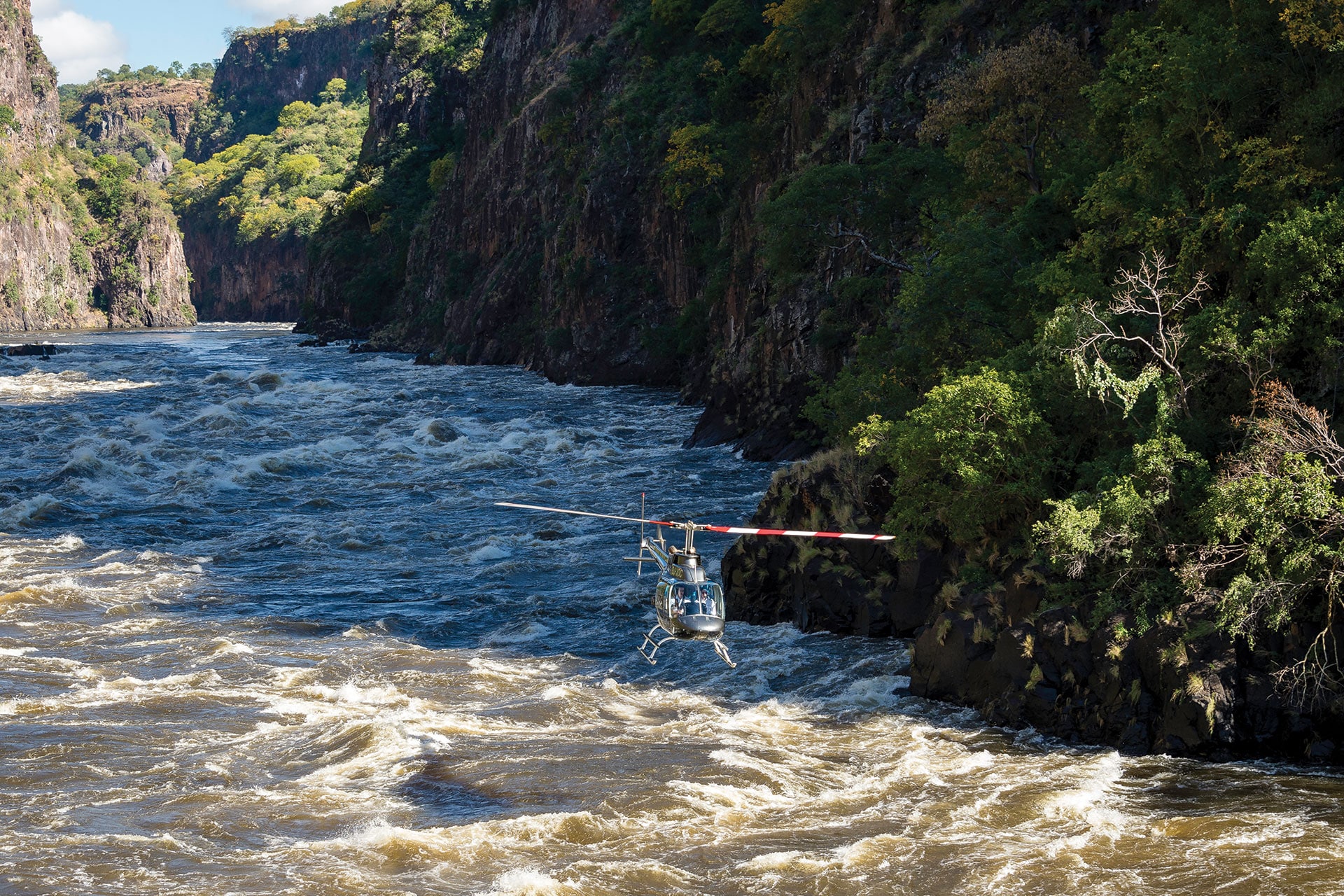 Helicopter flying through Batoka Gorge at Victoria Falls