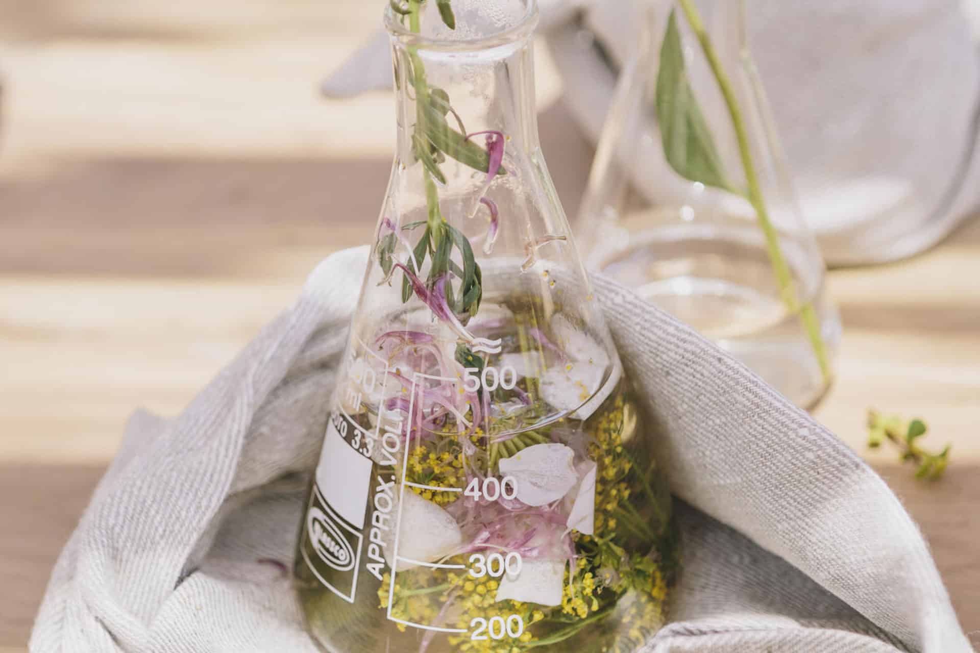 A glass bottle of scented herbs at Babylonstoren Farm and Hotel
