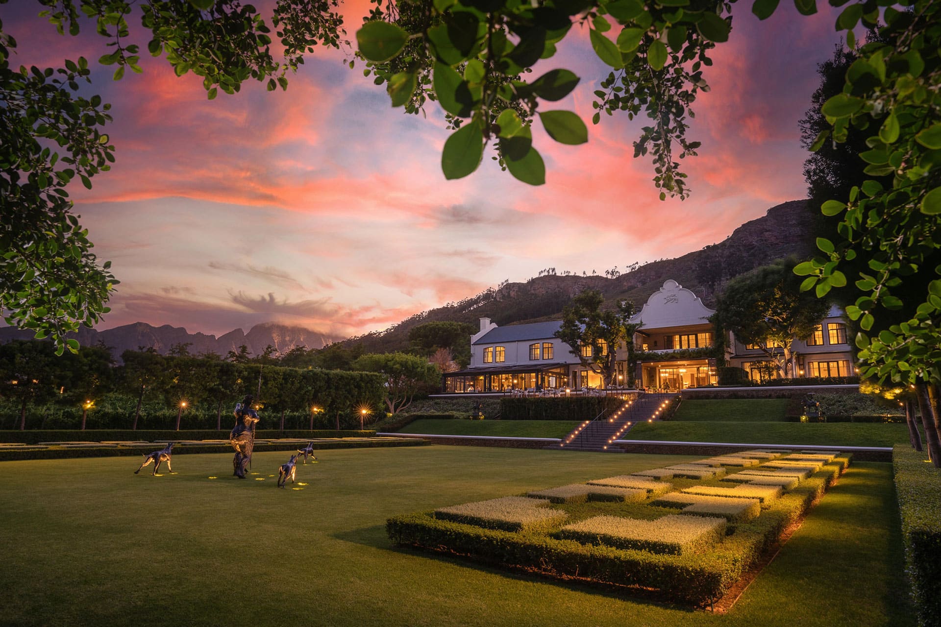 The garden and hotel during sunset at Leeu Estates