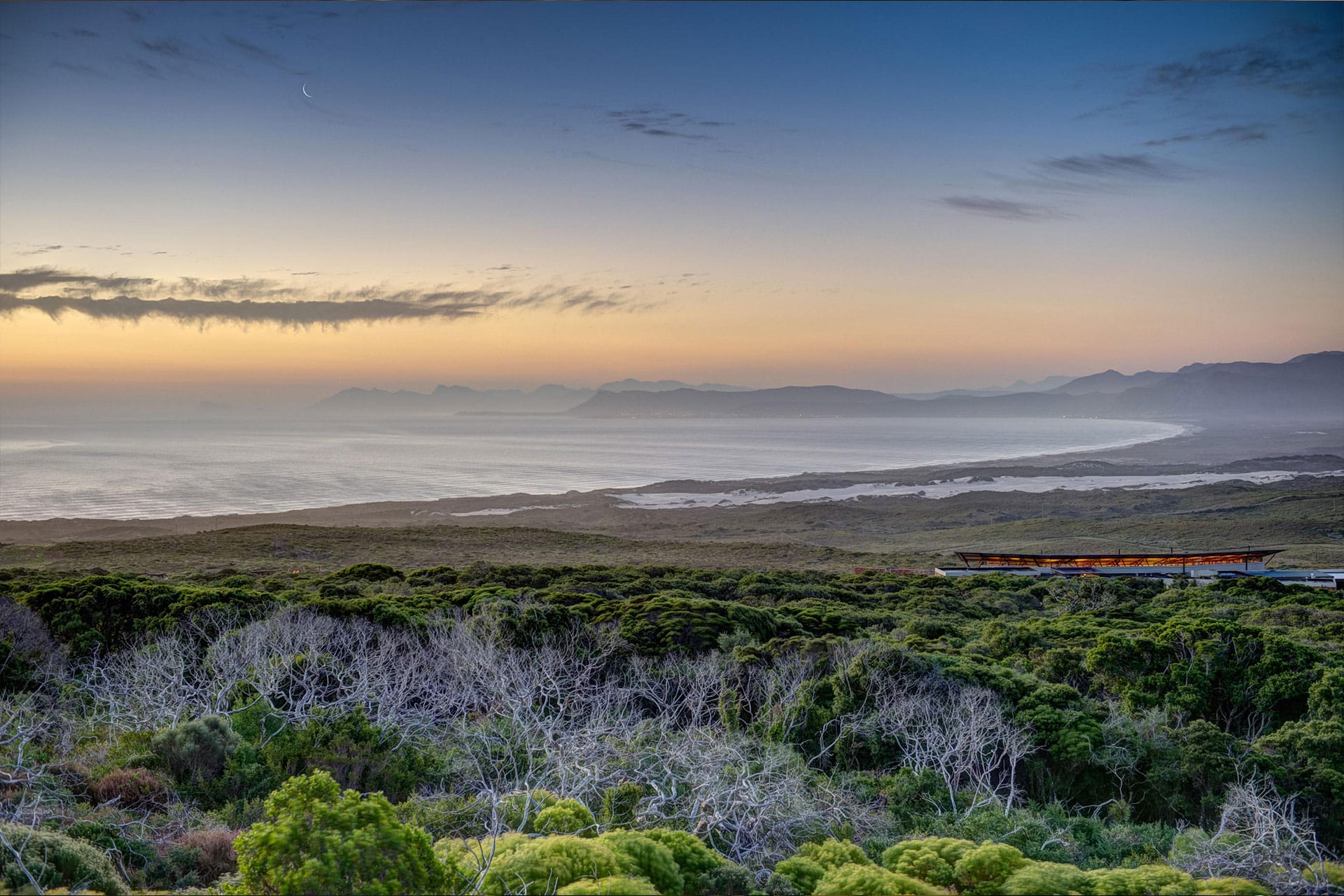A sun setting over the ocean at Grootbos