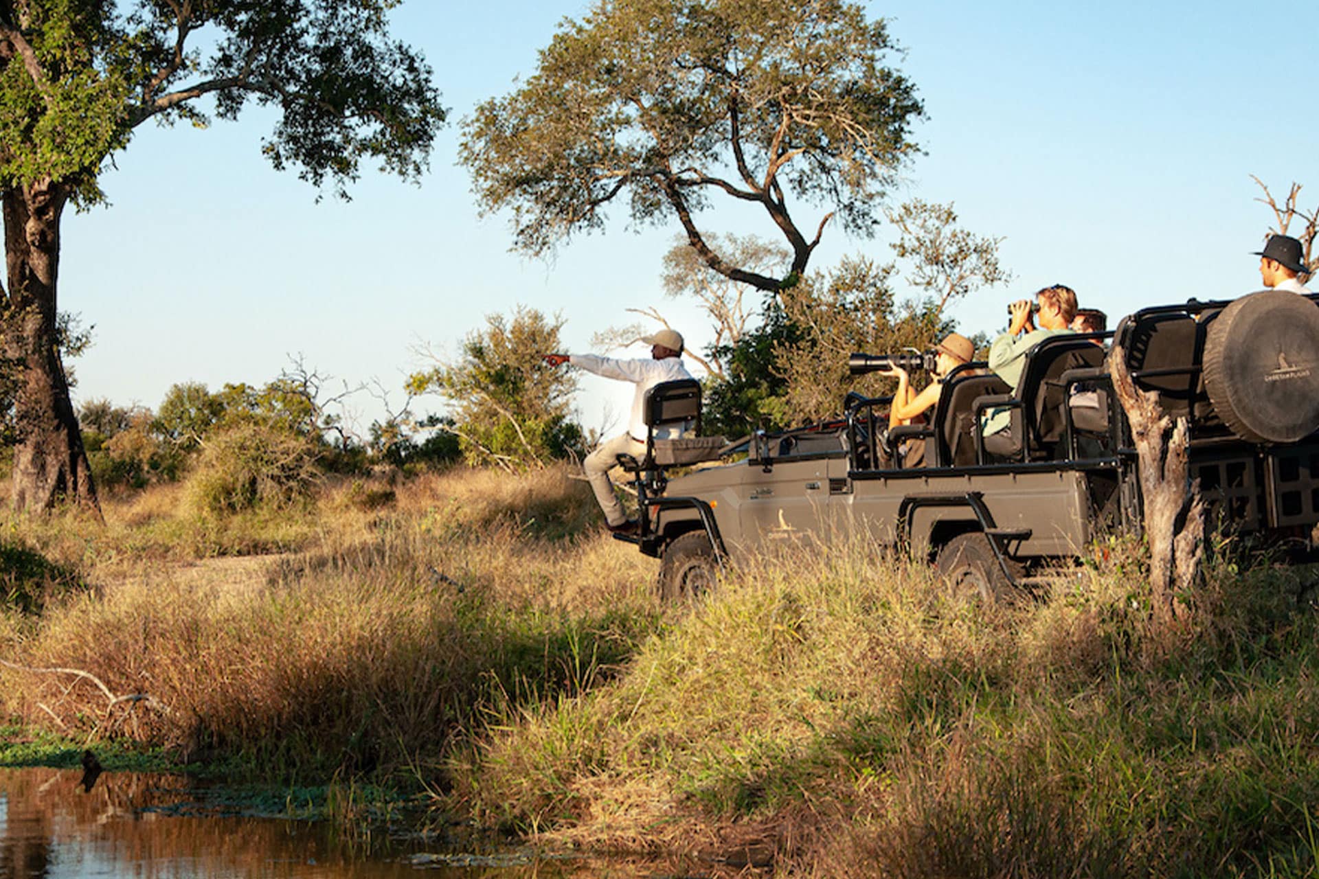 People going on a game drive in the Sabi Sands Game Reserve using a Land Cruiser electric safari vehicle from Cheetah Plains.