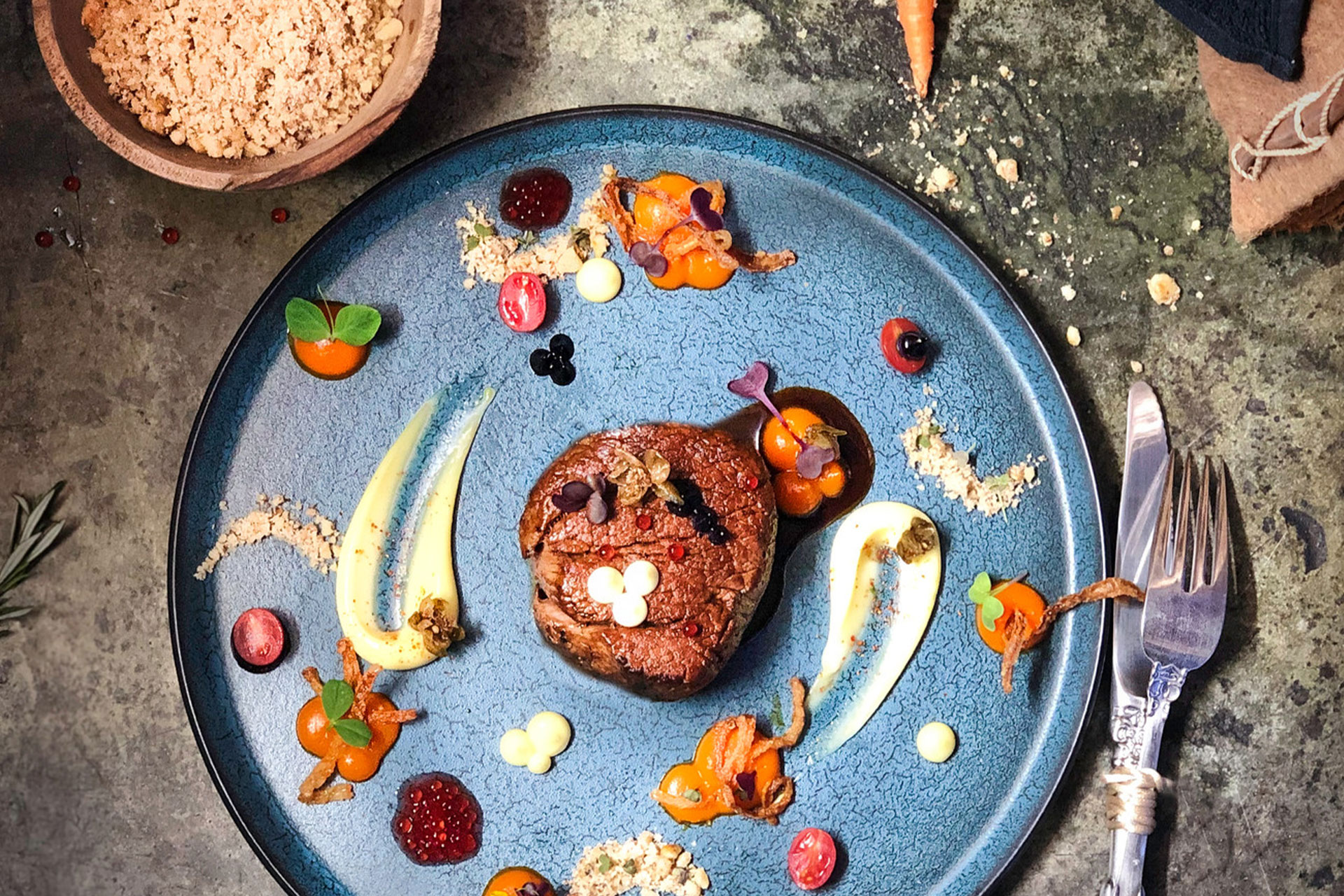 A beef fillet and accompaniments on a plate at Homespun by Matt – one of the top 10 fine dining restaurants in Cape Town.