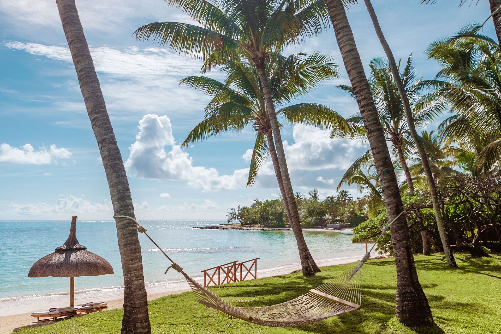 A hammock between two palm trees at the One&Only Le Saint Géran in Mauritius.