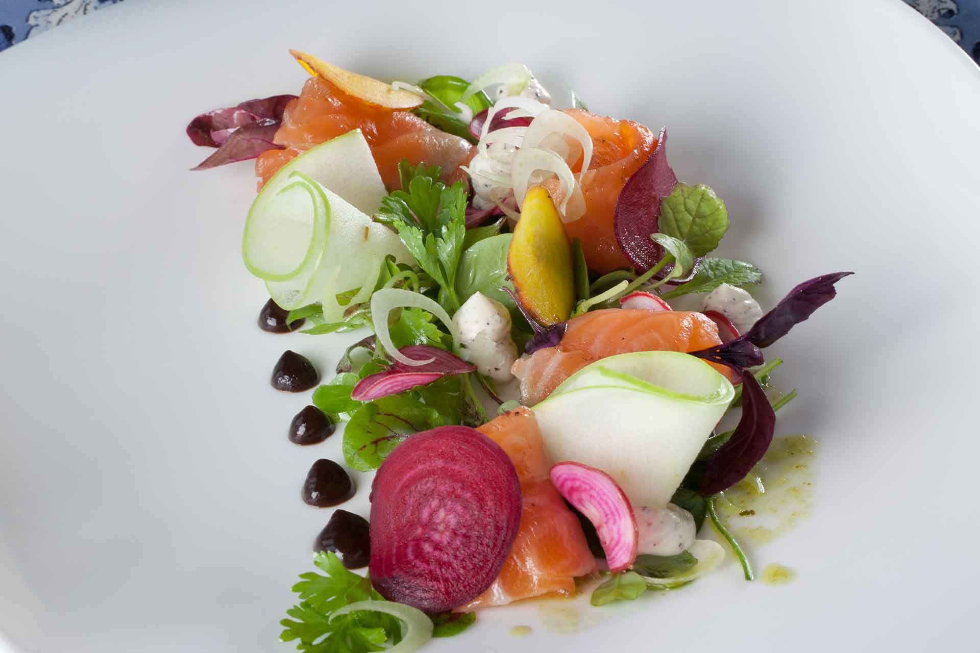 Salmon dish with De Grendel wine at De Grendel Restaurant – one of the top Cape Winelands restaurants.