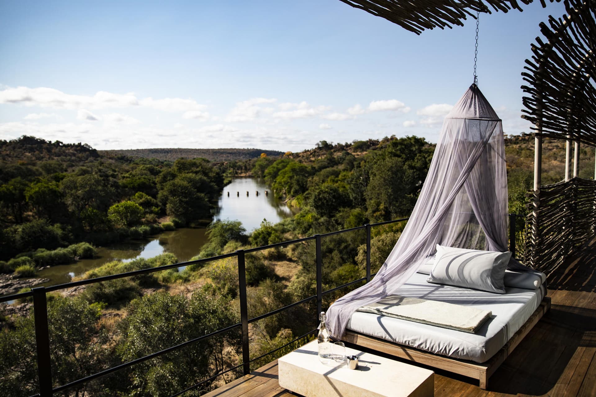 A bed on a viewing deck at Singita Lebombo – a recommended destination for honeymoons in Africa.