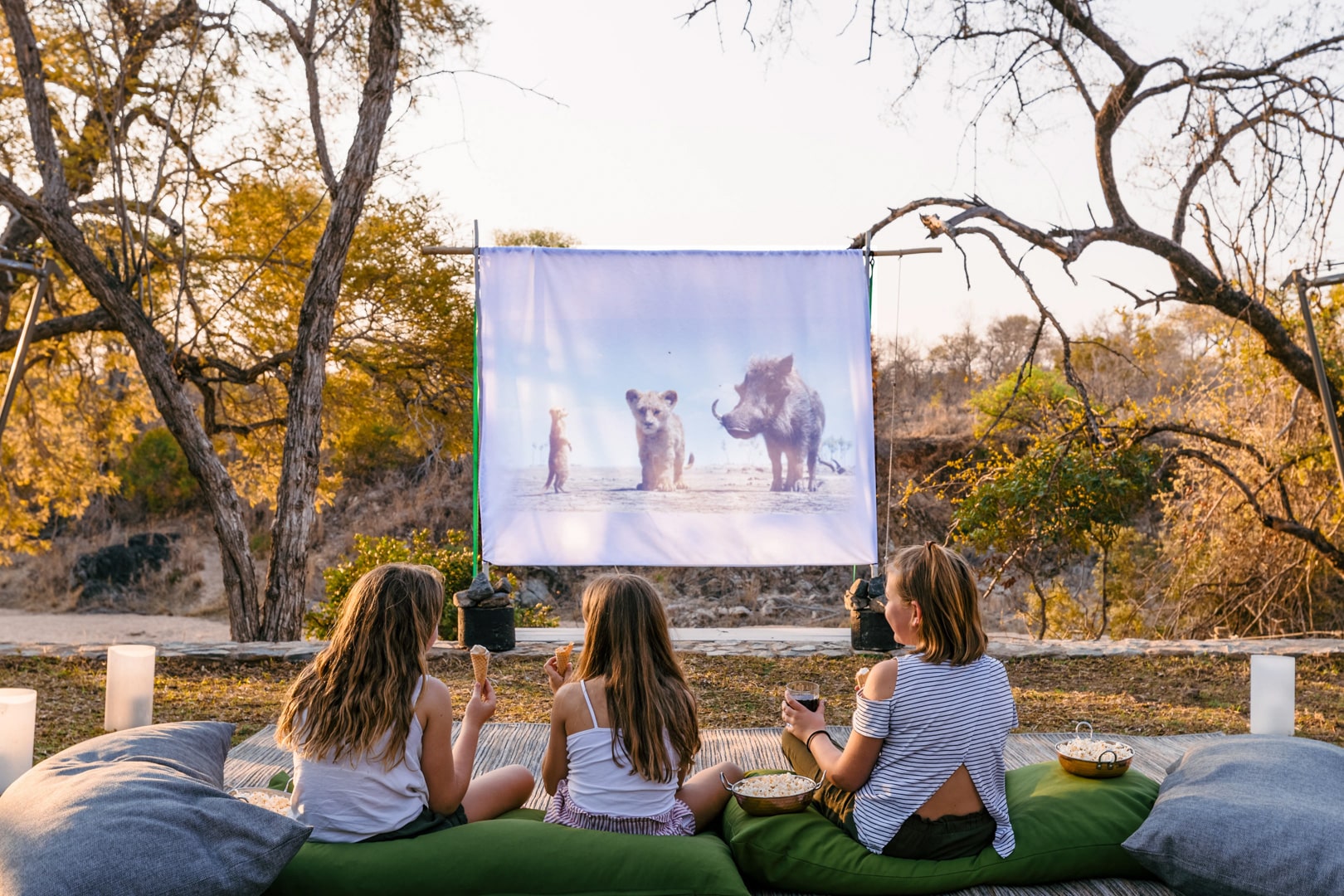 Kids watching a movie on a projector at Thornybush Game Lodge – one of Southern Africa’s best family friendly lodges.