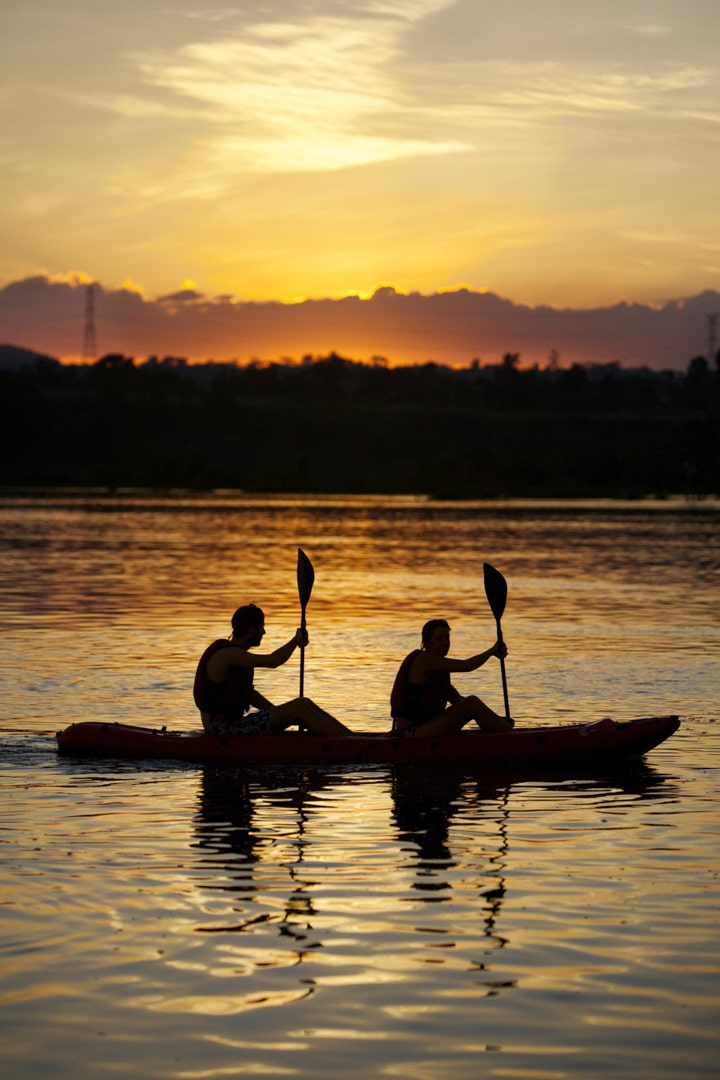 Paddle into the sunset aboard a kayak along the Nile River - a tranquil activity along the Nile River in Uganda.