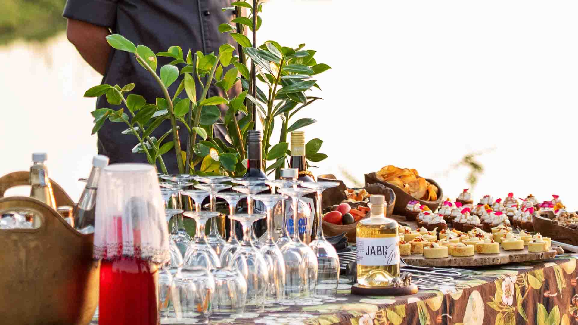 A table with glasses and snacks set up for sundowners at Jabulani Safari lodge.