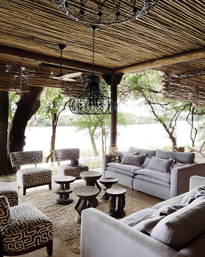 Enjoy the tranquility of the outdoor lounge at Matetsi River House - one of the top villas in Africa.