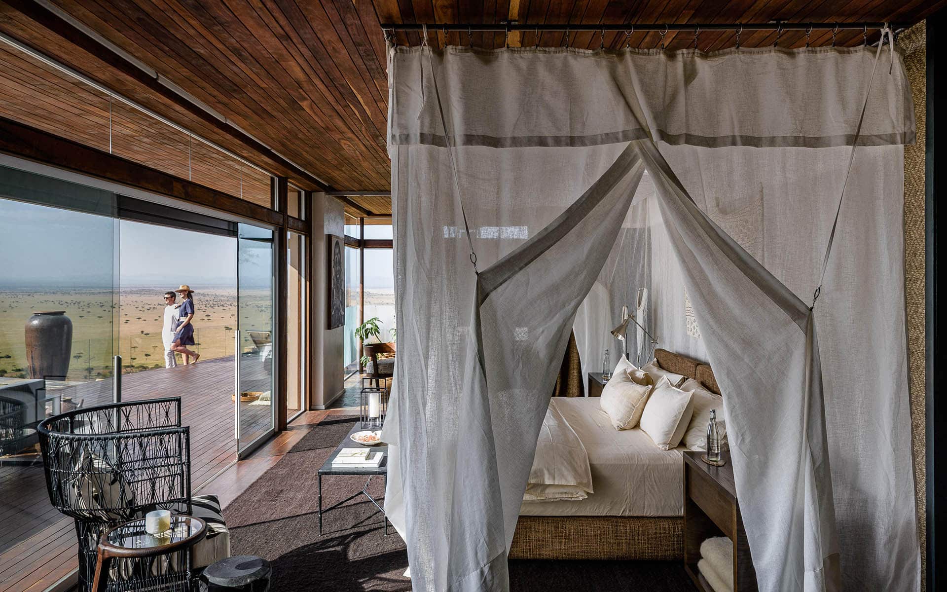 A luxury bedroom at Singita Sasakwa – a top choice for the responsible traveler.