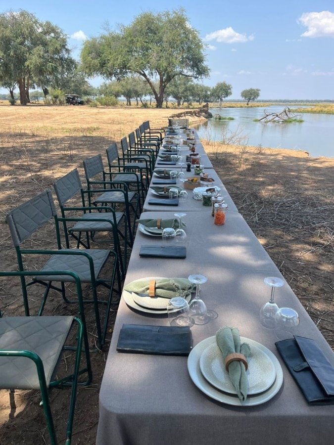 A bush lunch set up at Lolebezi on the banks of the Zambezi River with Ker & Downey Africa