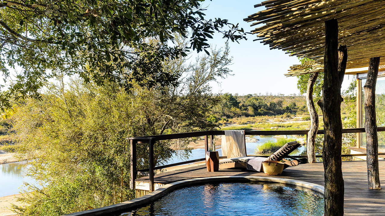 Heated safari pool at Singita Boulders with Ker & Downey Africa overlooking the Sand River