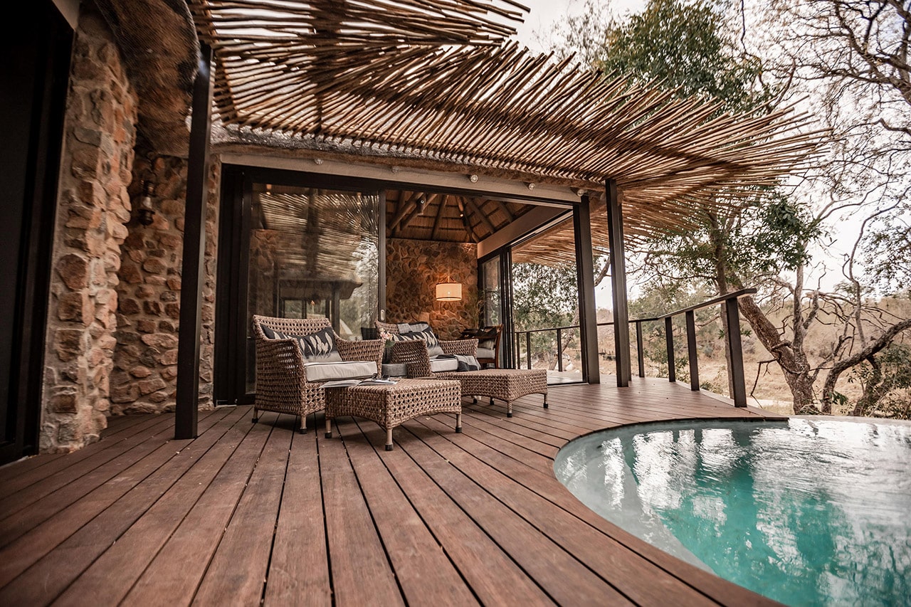 View of the wooden deck with furniture and safari pool at Dulini Moya