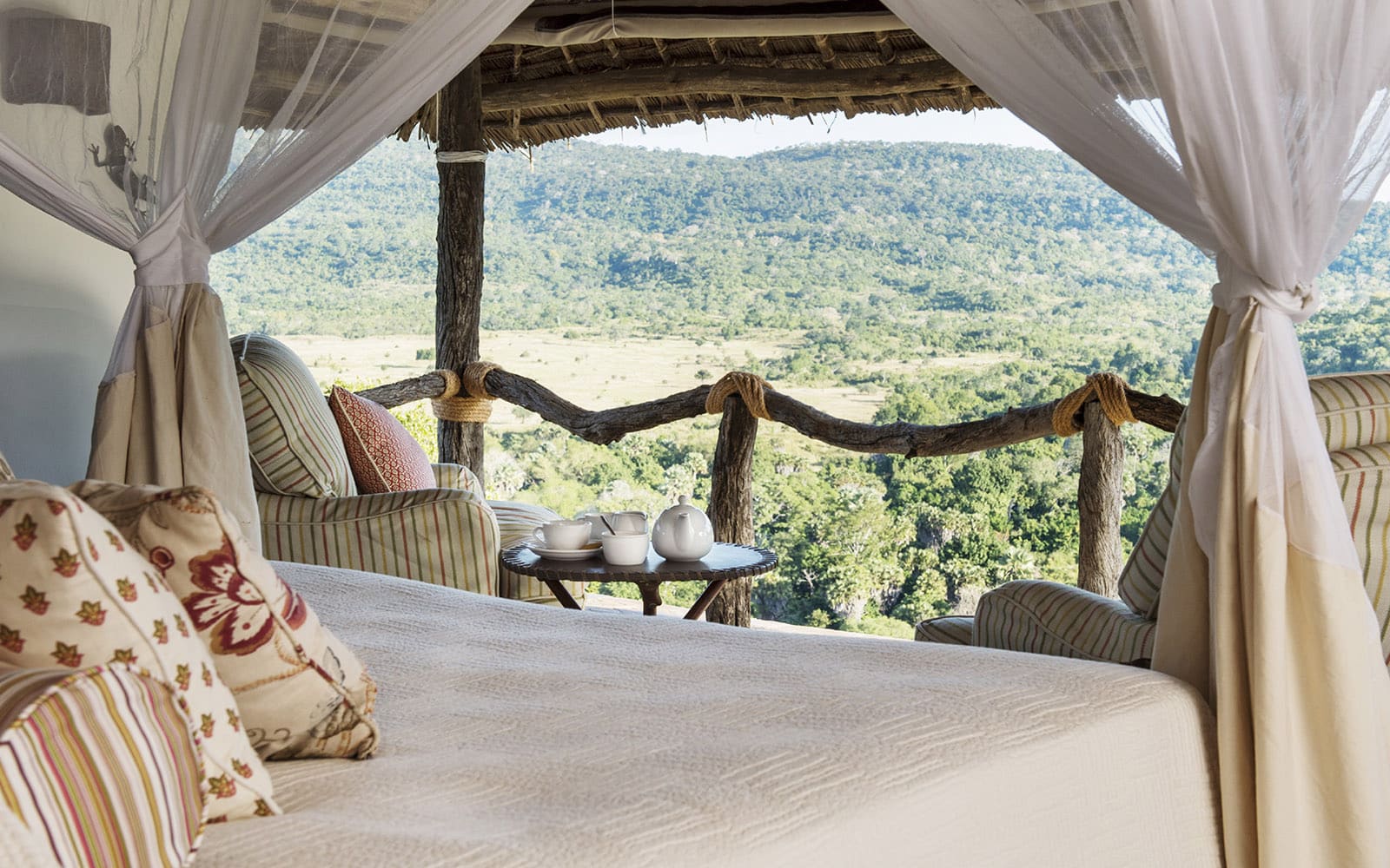 Bailey’s Banda bedroom with sweeping views, one of the lodges in Tanzania with Ker & Downey Africa