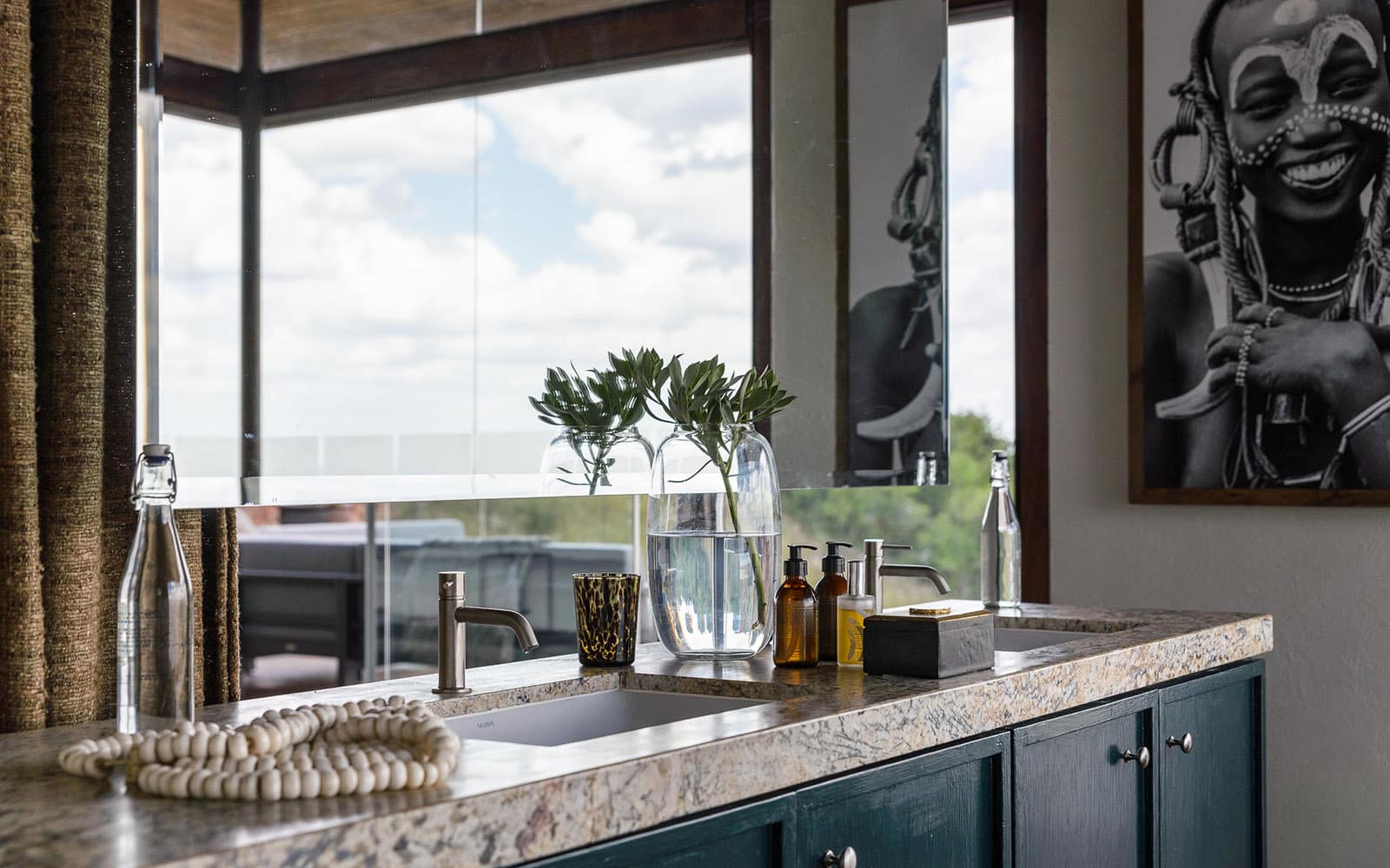 picture of the well-stocked bar at Singita Sasakwa with Ker & Downey Africa