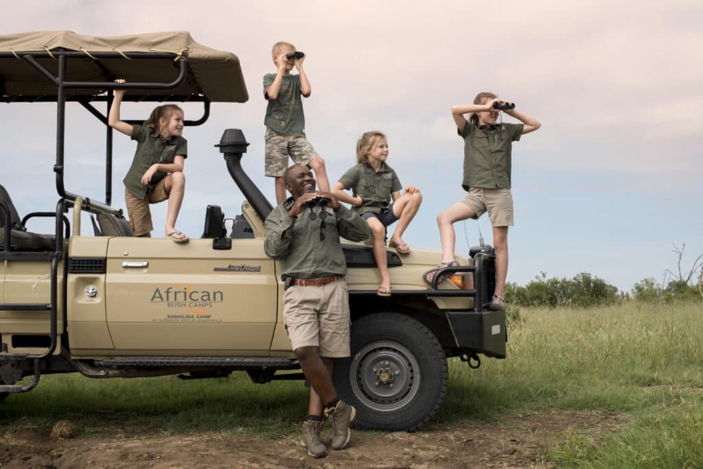 childrens with guide jeep safari school summer holiday