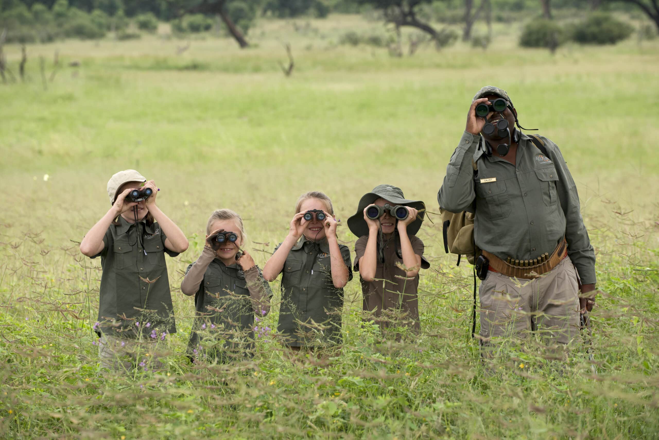 children with guide observation safari school winter holiday 