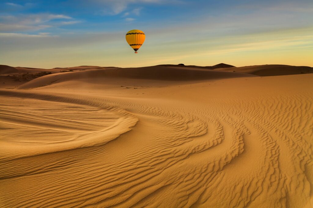 Hot Air Balloon in the desert at sunset background