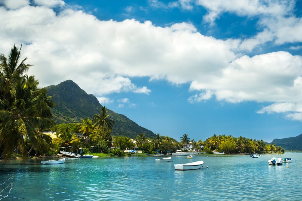 View of the mountain in Le Morne Brabant and the bay with boats on the island of Mauritius