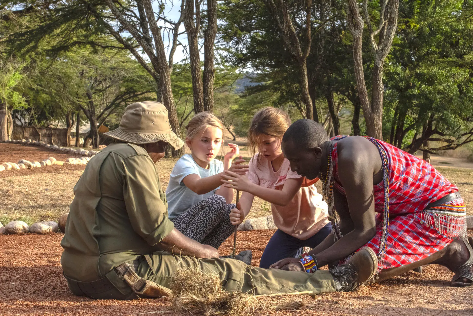 Copy of 1751633565644_Cottars-Safaris_1920s_maasai_warrior_school_fire.jpg