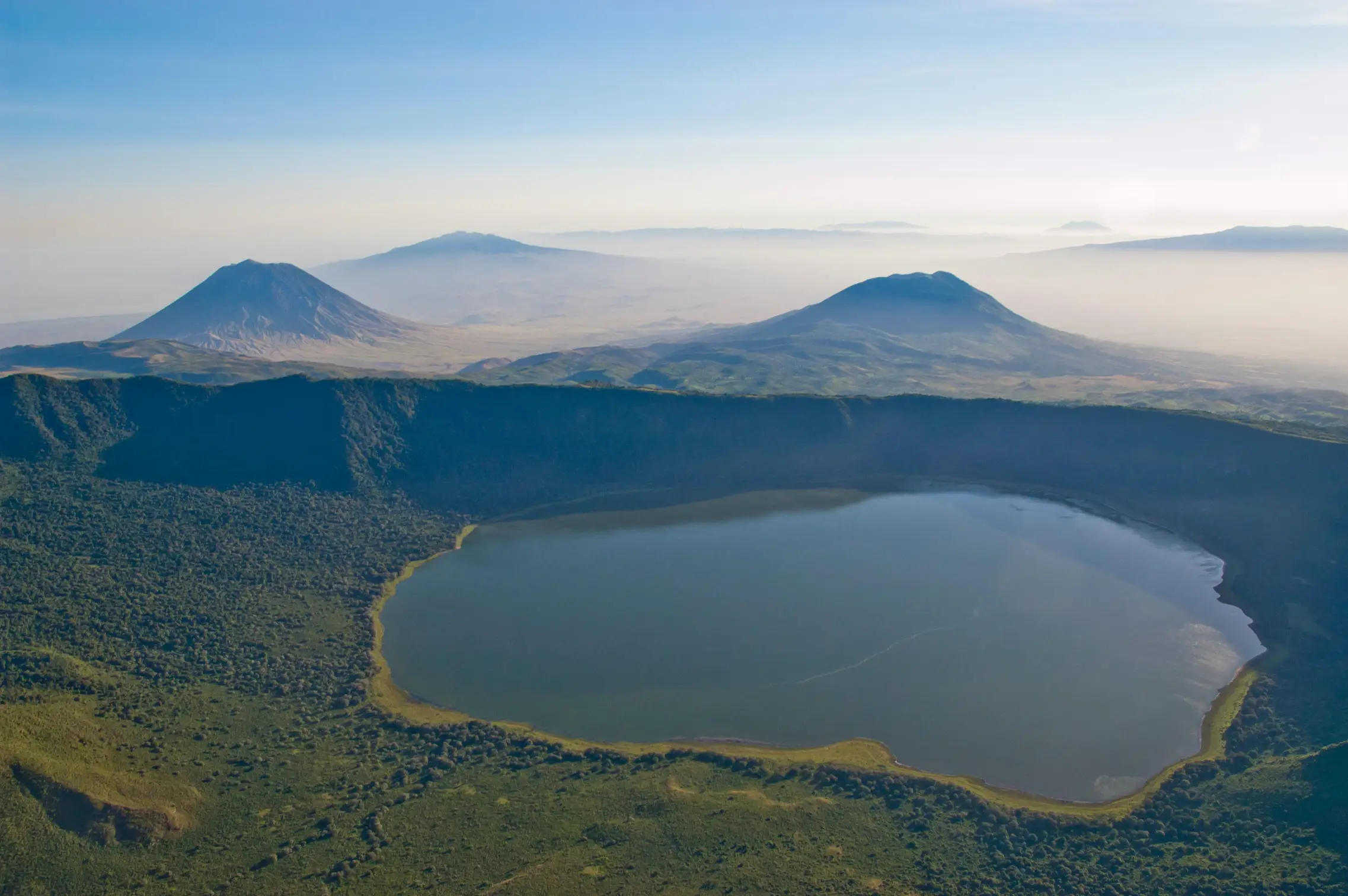 Best safaris in Africa to see the Big 5 across dramatic African crater landscapes and volcanic highlands during a Luxury family safari in Tanzania