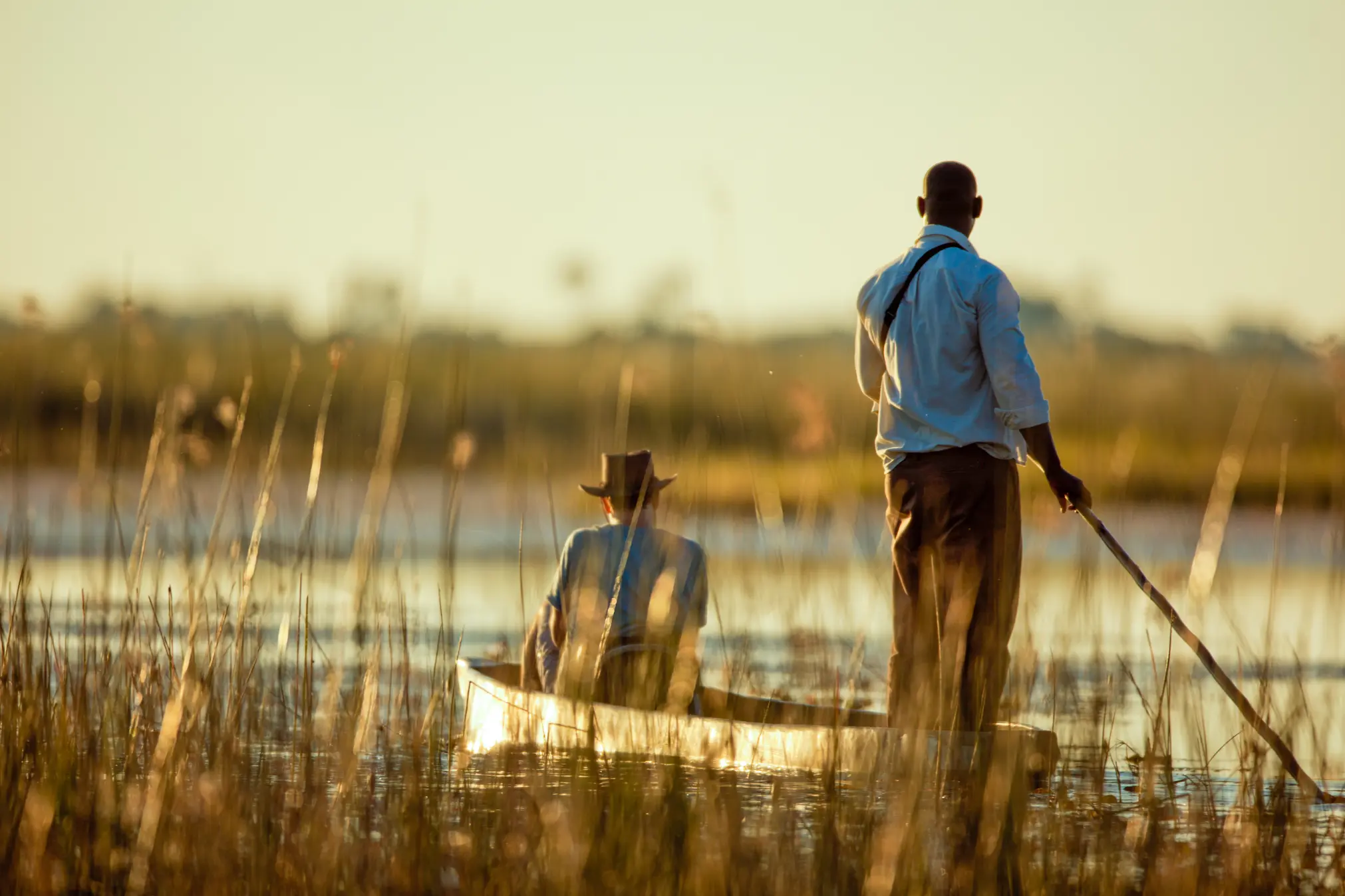 Solo traveler on a mokoro safari in Botswana's Okavango Delta
