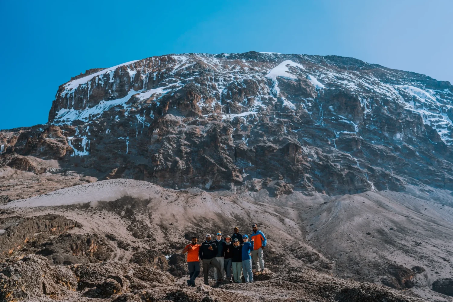 The team from Ker & Downey Africa with Mount Kilimanjaro in the background