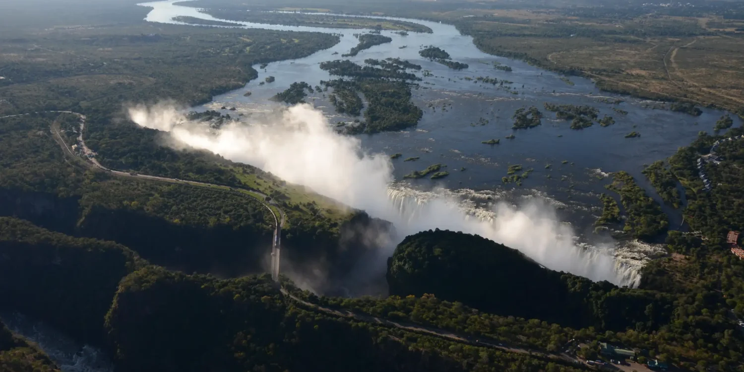 Aerial view of Victoria Falls and the Zambezi River, one of Africa’s top emerging travel destinations for scenic adventure