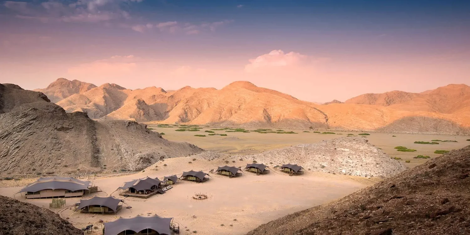 Luxury-Eco-Lodges_0006_Hoanib-Valley-Camp-Arial-tents-at-dusk