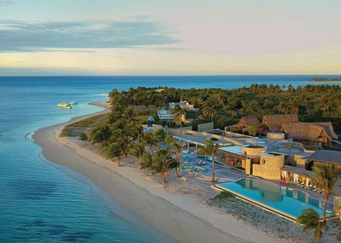 Luxury island resort with infinity pool set along a pristine coastline on exclusive Islands in Africa